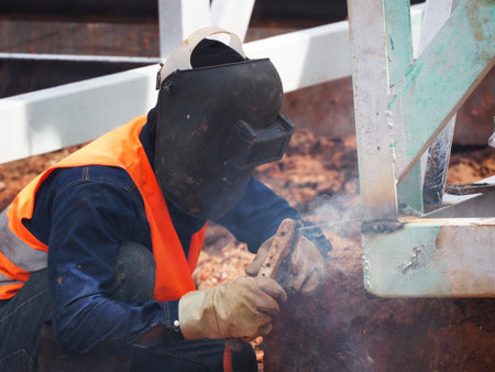 Welding work ,worker with protective welding metal on construction