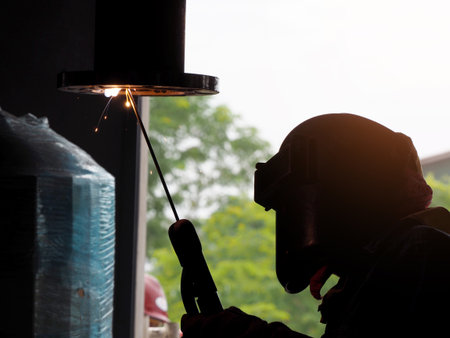 Welding work ,worker with protective welding metal on construction