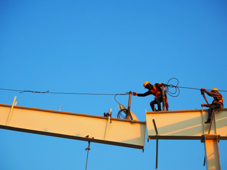 Man Working on the Working at height on construction site with blue sky