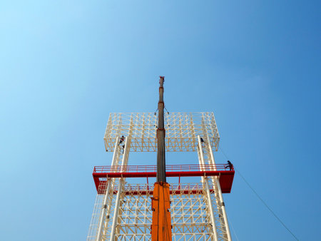 Man Working on the Working at height on construction site with blue skyの写真素材