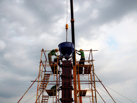 Man Working on the Working at height on construction site with blue sky