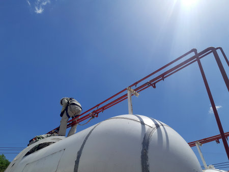 worker inspection at flange pipe of visual check record pipeline tank farm gas