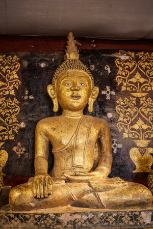 Old antique statue of Buddha in a temple room. Thailandのeditorial素材