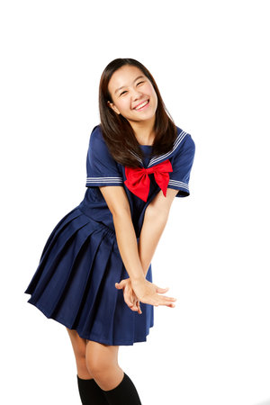 Japanese style school girl white background.の写真素材