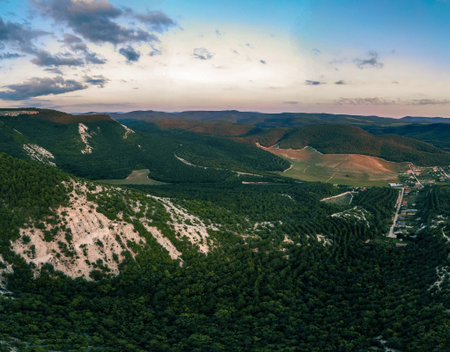top view of the green forests, mountains and village. Crimea.