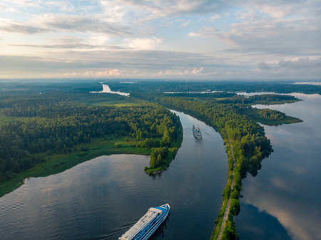 beautiful top view of the ships leaving the canal. forest and river in Russiaの写真素材