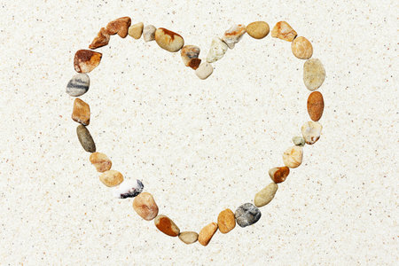 heart stone on the sandの写真素材