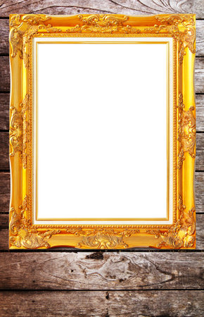 gold modern Antique pattern frame on vintage wooden wall isolated の写真素材