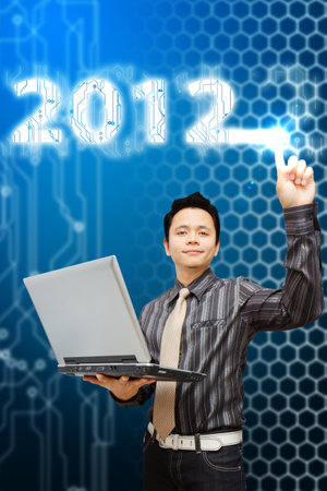 Smart Business man touch the electric 2012 year 