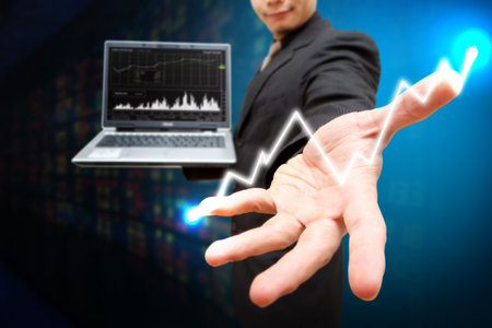 Business man present the report graph and light の写真素材