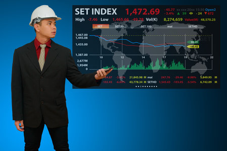 Business man with graph report for financialの写真素材