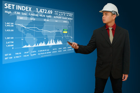 Business man with graph report for financialの写真素材