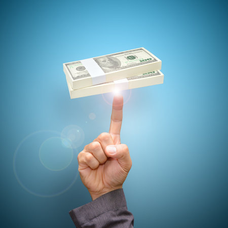 Finger point to dollar billsの写真素材