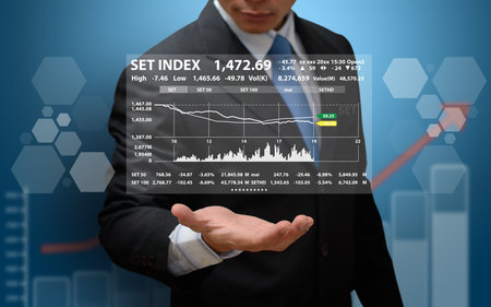 Business people analyzing financial chartsの写真素材