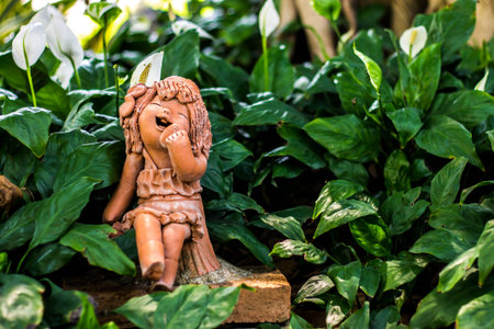 Girl clay sculpture in nature の写真素材