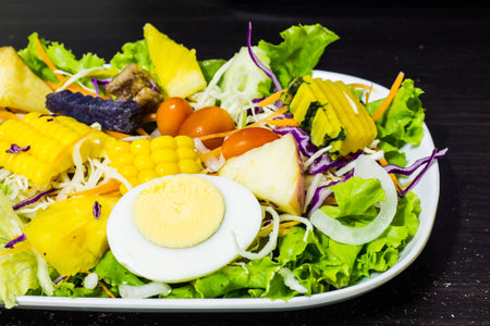 Vegetables and fruits salad with boiled eggの写真素材