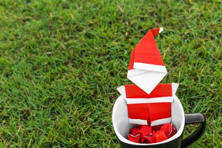 Origami santa claus on glassの写真素材