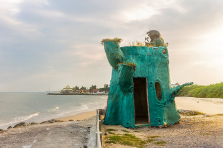 Green tree house on the beachの写真素材