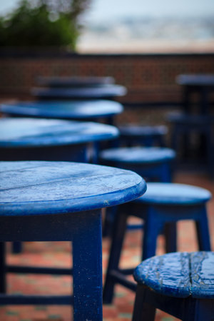 Table and chairs colored in blueの写真素材