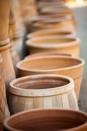 Row of hand crafted clay potsの写真素材