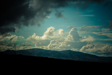 White clouds over the mountainの写真素材