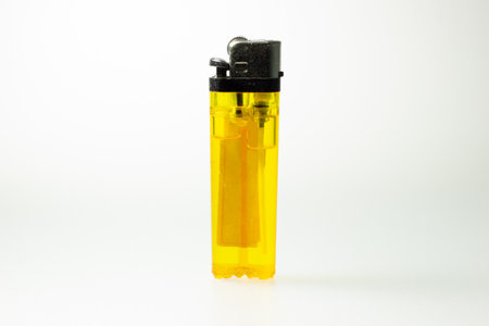 Yellow lighters on a white backgroundの写真素材