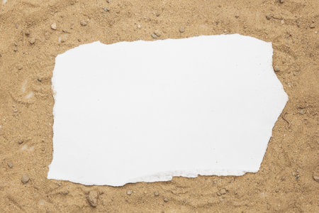 Blank paper concept for text on a sand backgroundの写真素材