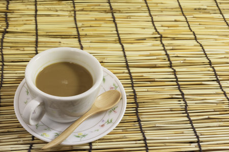 coffee cups with wood spoon bamboo background. Copy space.の写真素材