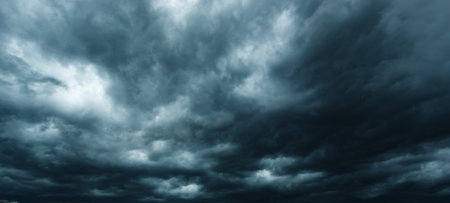 The dark sky had clouds gathered to the left and a strong storm before it rained.Bad weather sky.