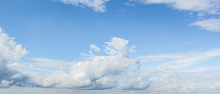 blue sky background with white clouds cumulus floating soft focus, copy space