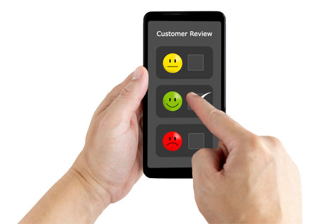 hand touching the application on the happy smile face icon to give satisfaction in service.rating very impressed.Customer service and Satisfaction concept.の写真素材