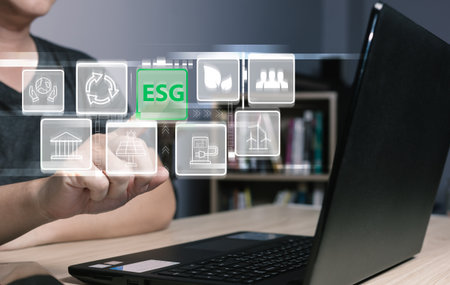 hand touch hologram to save energy,and reduce global warming,climate change,ecology friendly investment,ESG environment social governance,Green Business Innovation and Sustainable Development concept.の写真素材