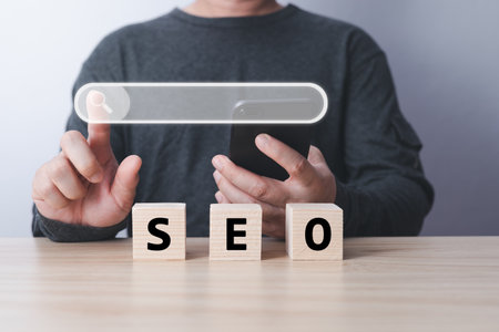 Searching Browsing Internet Data Information with blank search bar. hand of businessman working with smartphone . Search Engine Optimization SEO Networking Concept.の写真素材