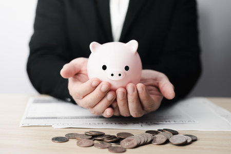 business finance and saving money investment for buying a home, Money coin stack with piggy bank saving concept. Idea for investing in real estate or property.の写真素材