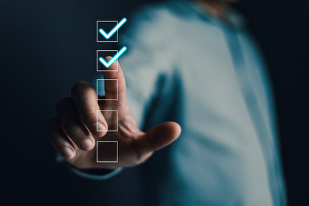 Businessmen touch the checkbox on a box in the list shown on the virtual screen. Check marks on the checklist survey items and questionnaires. Business management goal strategy concept.の写真素材