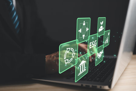 ESG for Environment Social and Governance. hand hold hologram screen to save energy,and reduce global warming,sustainable business investments,carbon credit,eco-friendly investment.の写真素材
