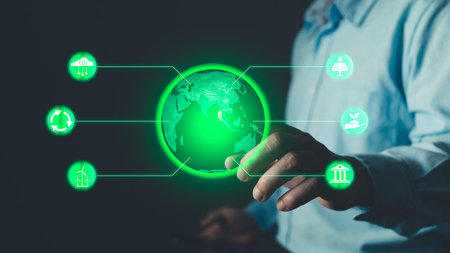 Climate change,hand hold hologram to save energy,and reduce global warming,ecology friendly investment,ESG environment social governance,Green Business Innovation and Sustainable Development concept.の写真素材