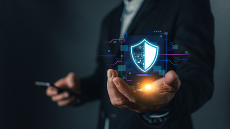 Cybersecurity and privacy protection network security computer and safe data concept. Businessmen protect personal data information from viruses on a laptop with virtual screen interfaces.の写真素材