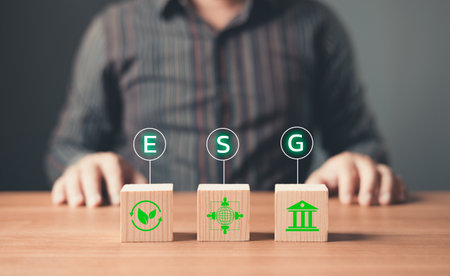 ESG environment social governance,Green Business Innovation and Sustainable Development concept.wood block with icon reduce co2,and reduce global warming,climate change,ecology friendly investment.の写真素材