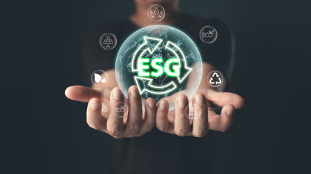 The glowing ESG icon symbolizes commitment to environmental, social,and governance principles,emphasizing sustainability,ethical practices,and eco-friendly solutions for a balanced,responsible future.の写真素材
