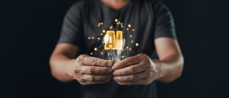 A person holds a glowing lightbulb with digital connections and the text AI inside, symbolizing...