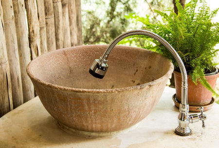 Baked clay sink and faucetの写真素材