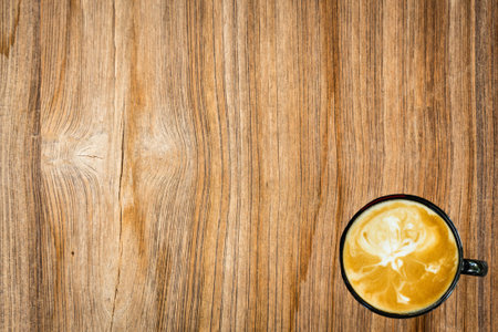 Latte art on wood backgroundの写真素材