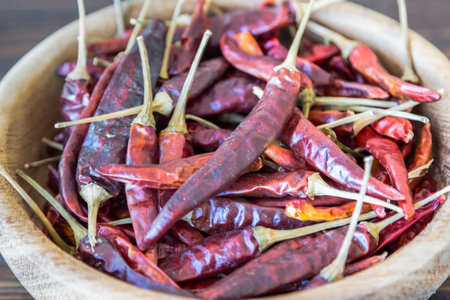 Dry red pepper in wood bowl