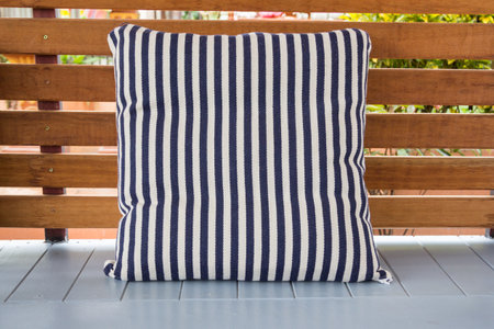 close up of blue and white striped pillow on terreceの写真素材