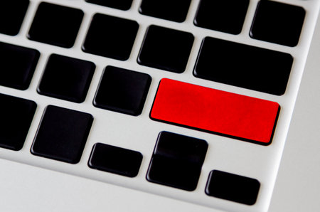 blank red button on black computer keypad close-upの写真素材