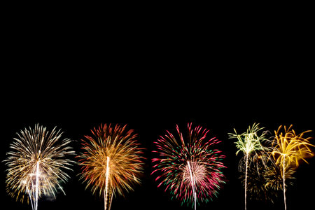 colourful fireworks light up for celebration on dark background