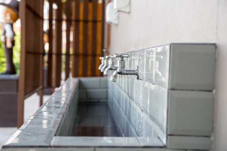 faucet and the long sink at the toilet