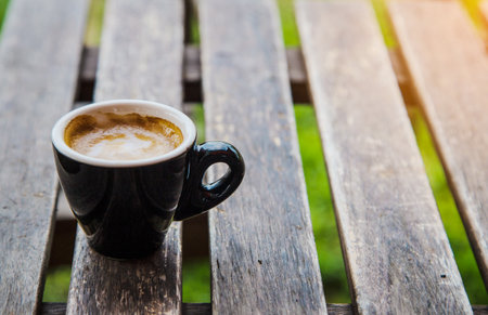 cup of hot coffee on wood table backgroundの写真素材