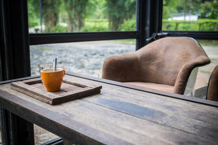 cup of coffee on wood table at the coffee corner